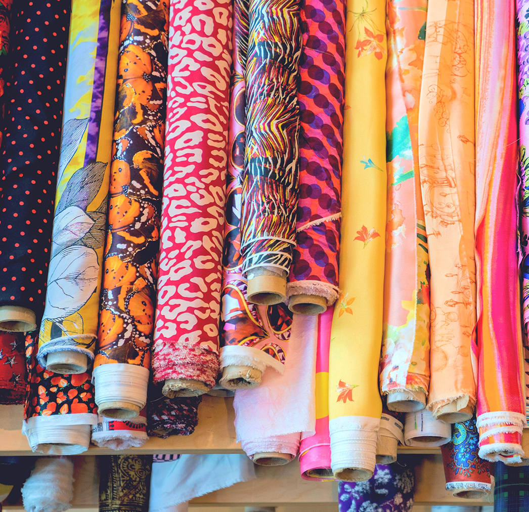 Silk Fabric Bolts Piled on Table